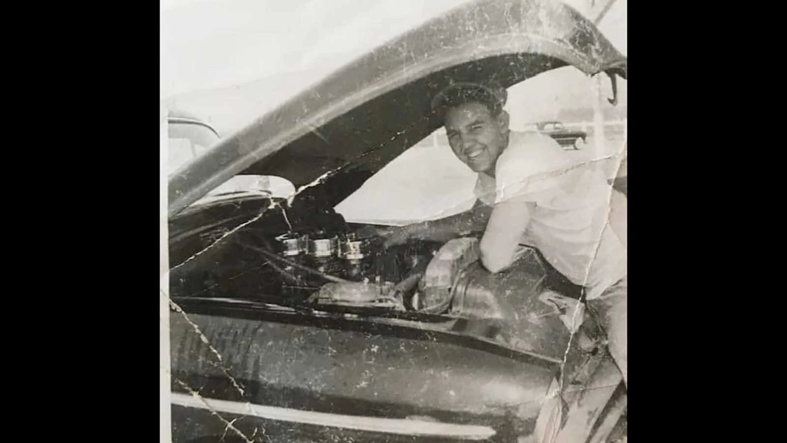 Wayne Schell works on his 1950 Oldsmobile.