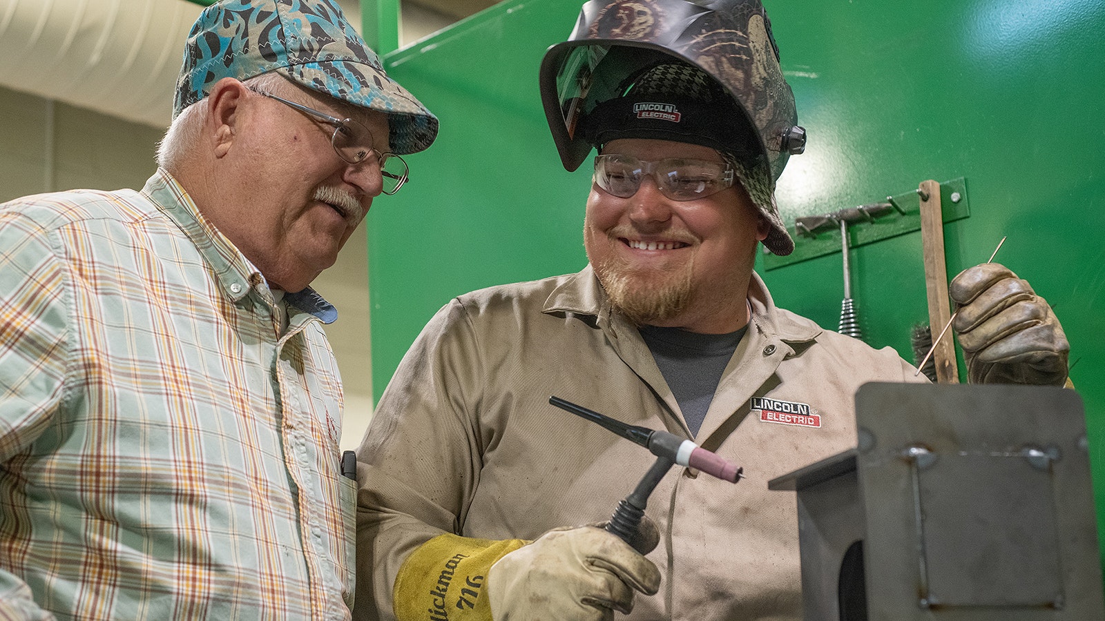 Easatern Wyoming College welding student Dayton Tillman works with instructor Stan Nicolls.