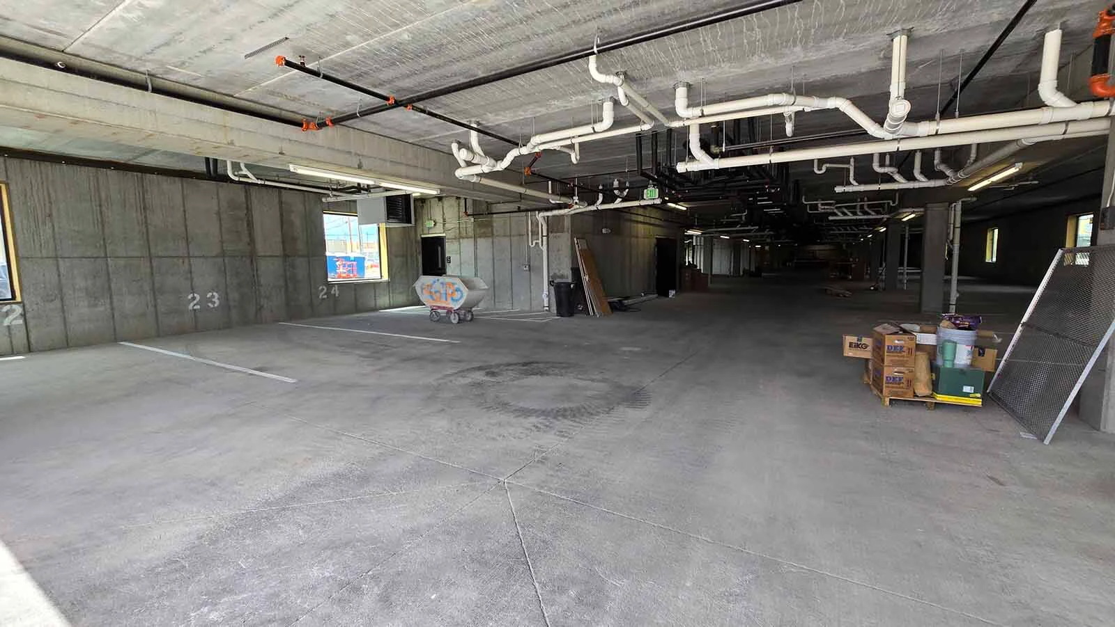 The ground floor of West End apartments is a parking garage.