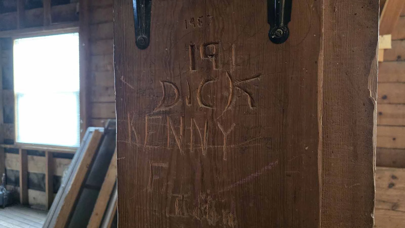 Bored employees carved their initials into the wooden beams inside the Ful-O-Pep grain elevator.