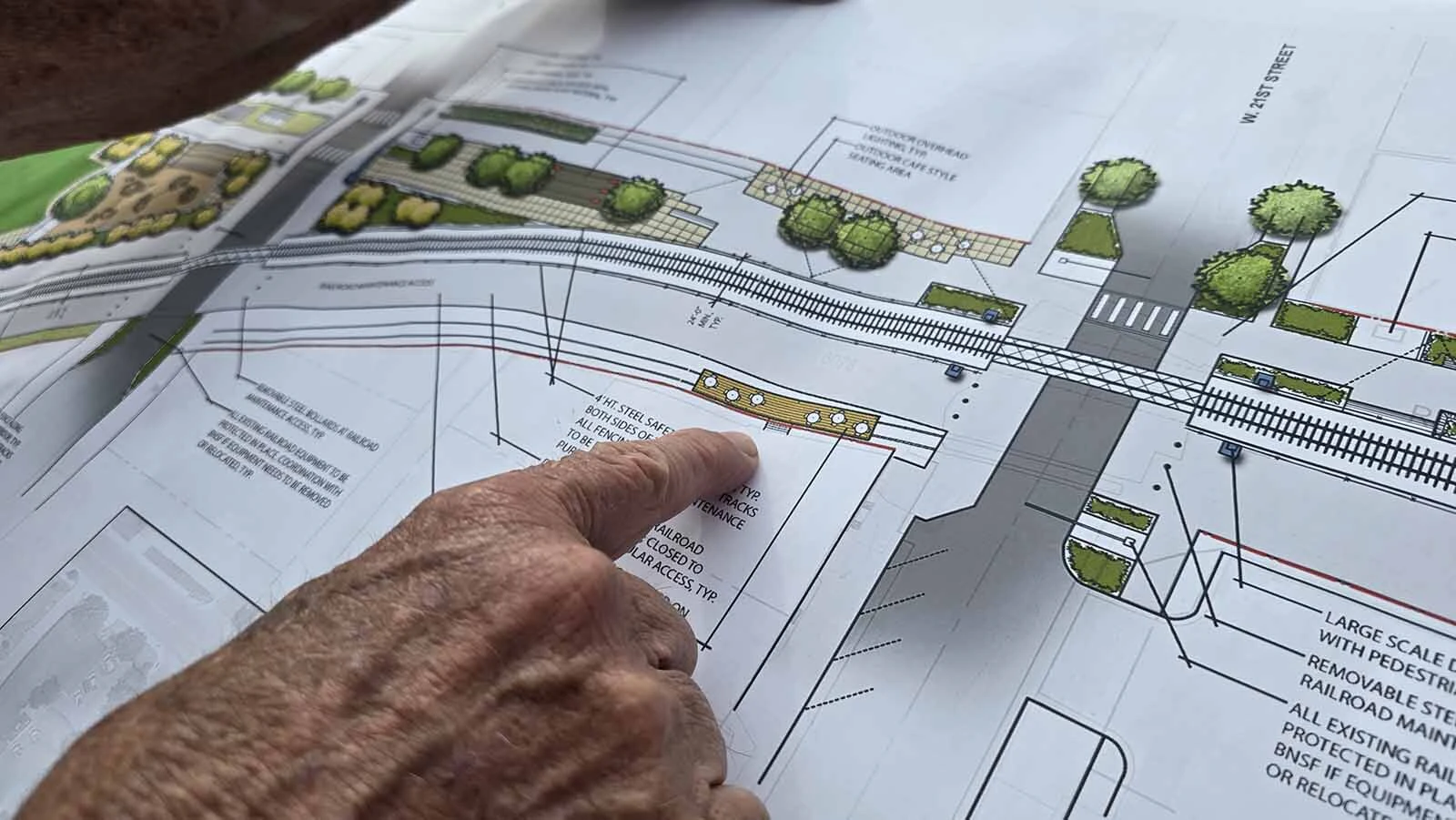 Cheyenne City Councilman Pete Laybourn holds up a map of the future Reed Avenue Corridor project, envisioned as a scenic, walkable area interspersed with retail businesses, including Westby's and now the Ful-O-Pep grain elevator's corner.