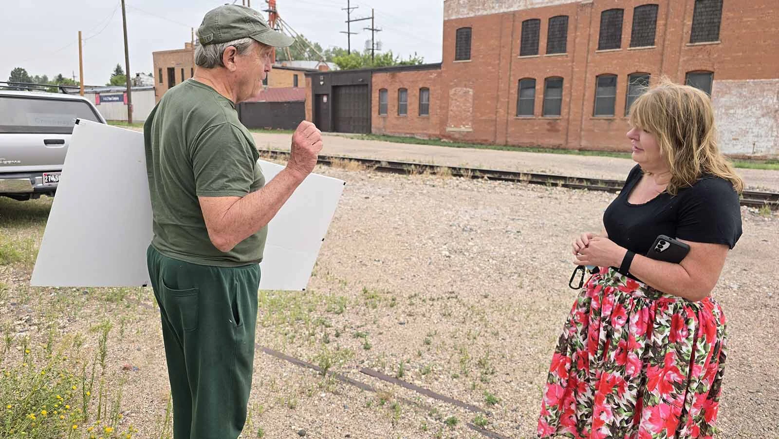 Sherrie Lyle listens as Cheyenne City Councilman Pete Laybourn talks about Cheyenne's plans for the Reed Avenue Corridor Project.