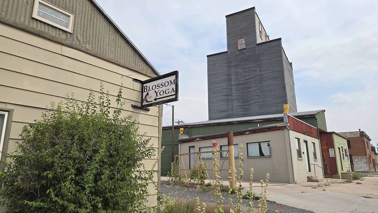 The carriage house sits across from the grain elevator.