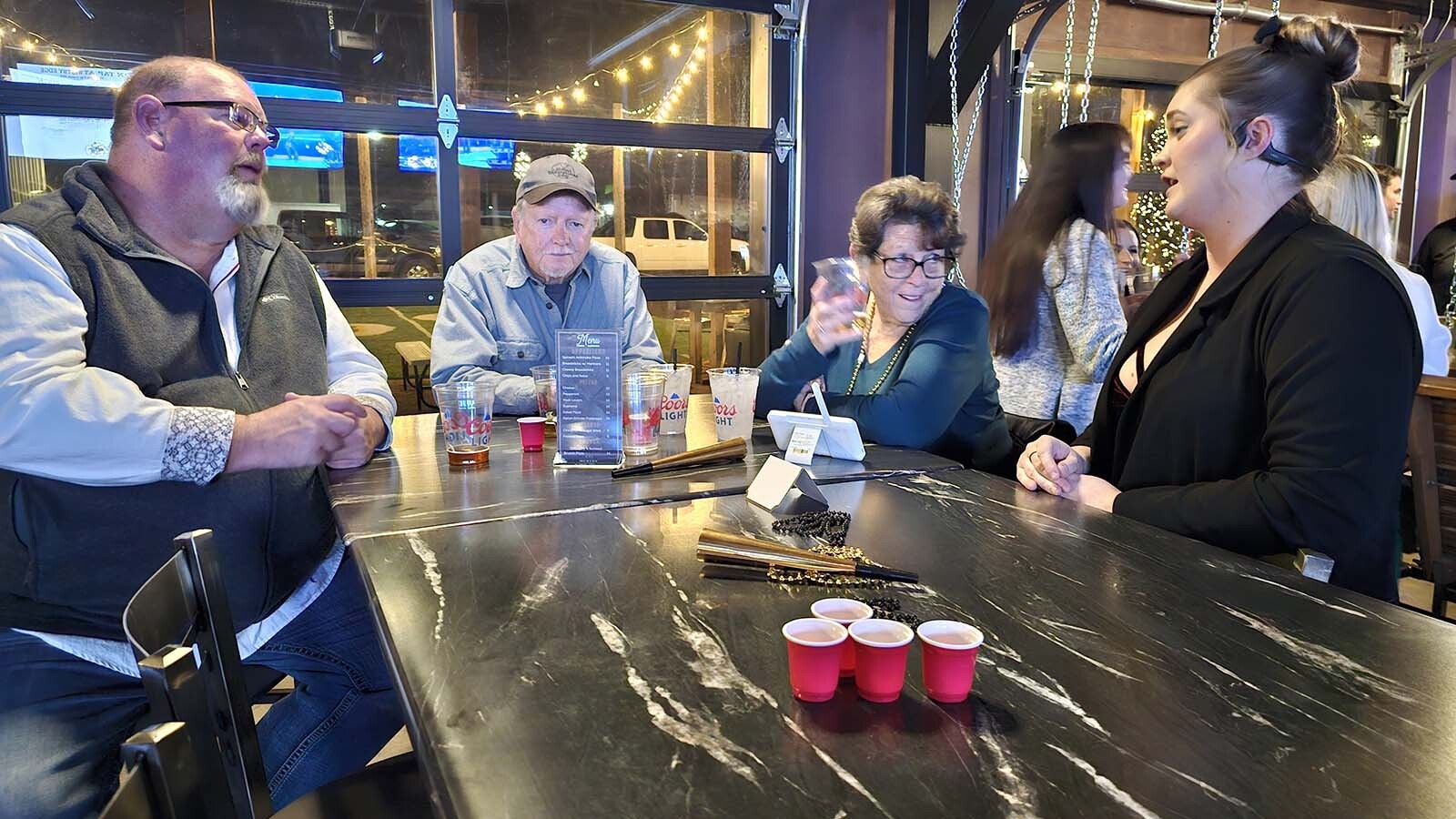 Master Brewer Brennan Westby (right) prepares for New Year's Eve and talks with his family at Westby Edge Brewing Company.
