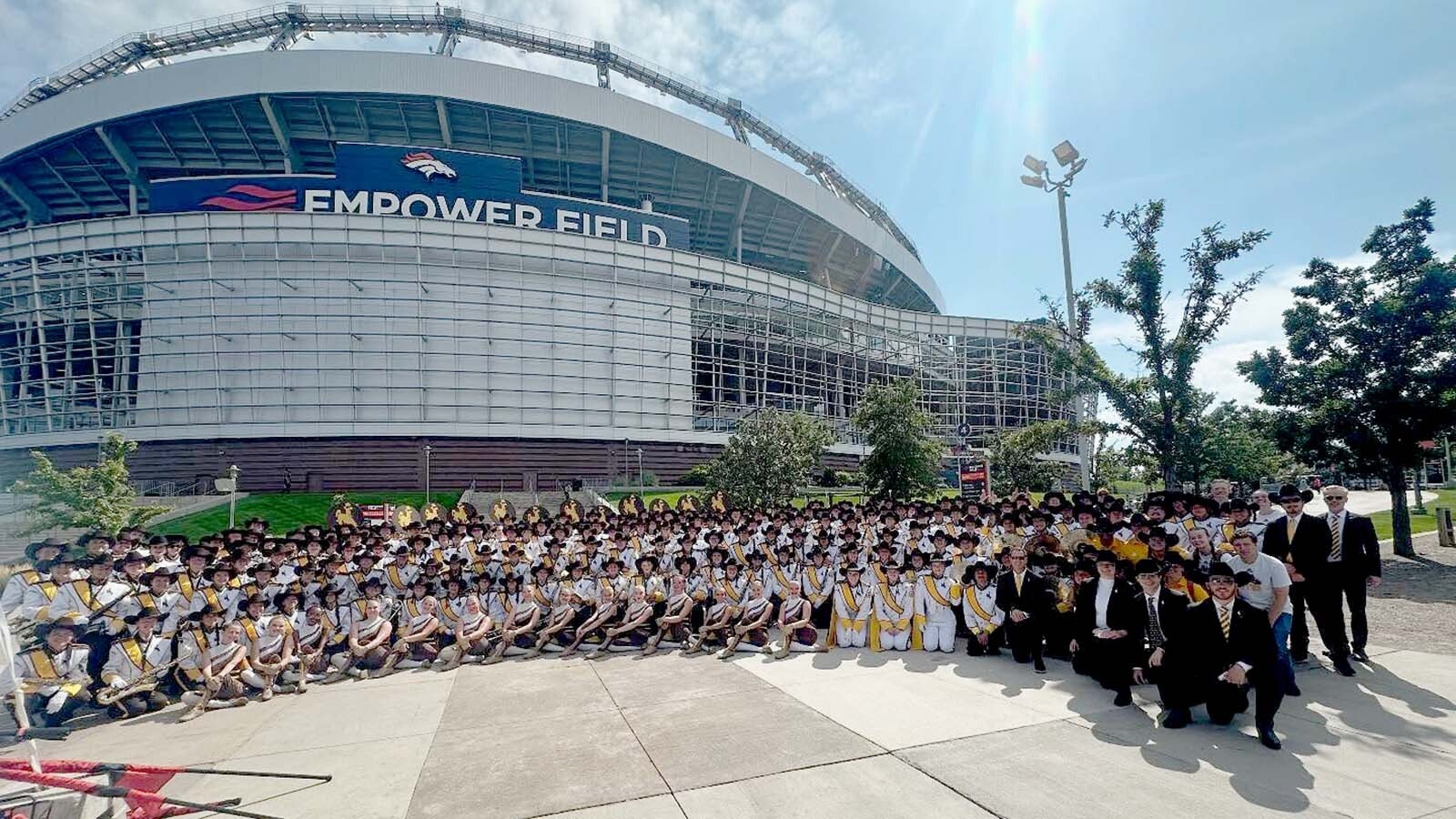 The Western Thunder Marching Band from the University of Wyoming outside Empower Field at Mile High on Sunday. The band was on the sideline ready to perform during halftime of a Broncos game when lightning delayed the game and canceled their performance.