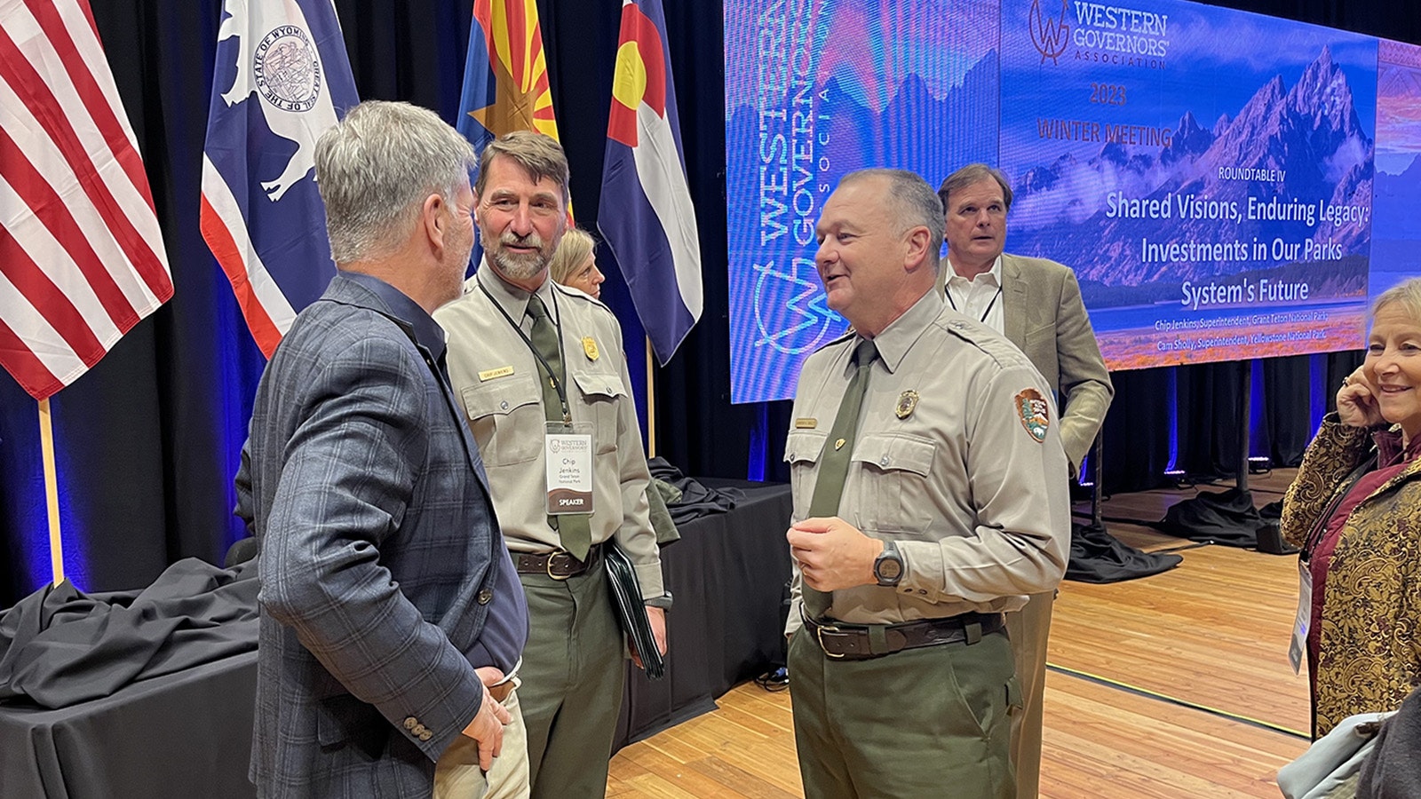 Gov. Mark Gordon, left, chats with Yellowstone National Park Superintendent Cam Sholly, right, and Grand Teton National Park Superintendent Chip Jenkins at Tuesday's Western Governors' Association meeting in Jackson, Wyoming, on Tuesday.