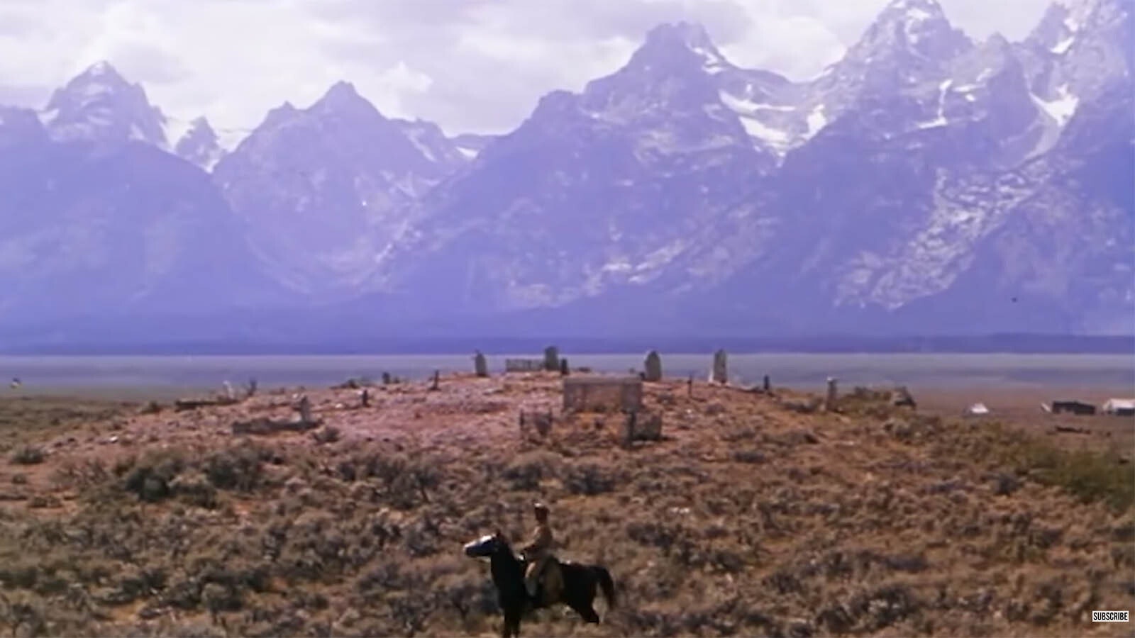 A scene from "Shane" set in front of a graveyard with the Grand Tetons in the background.