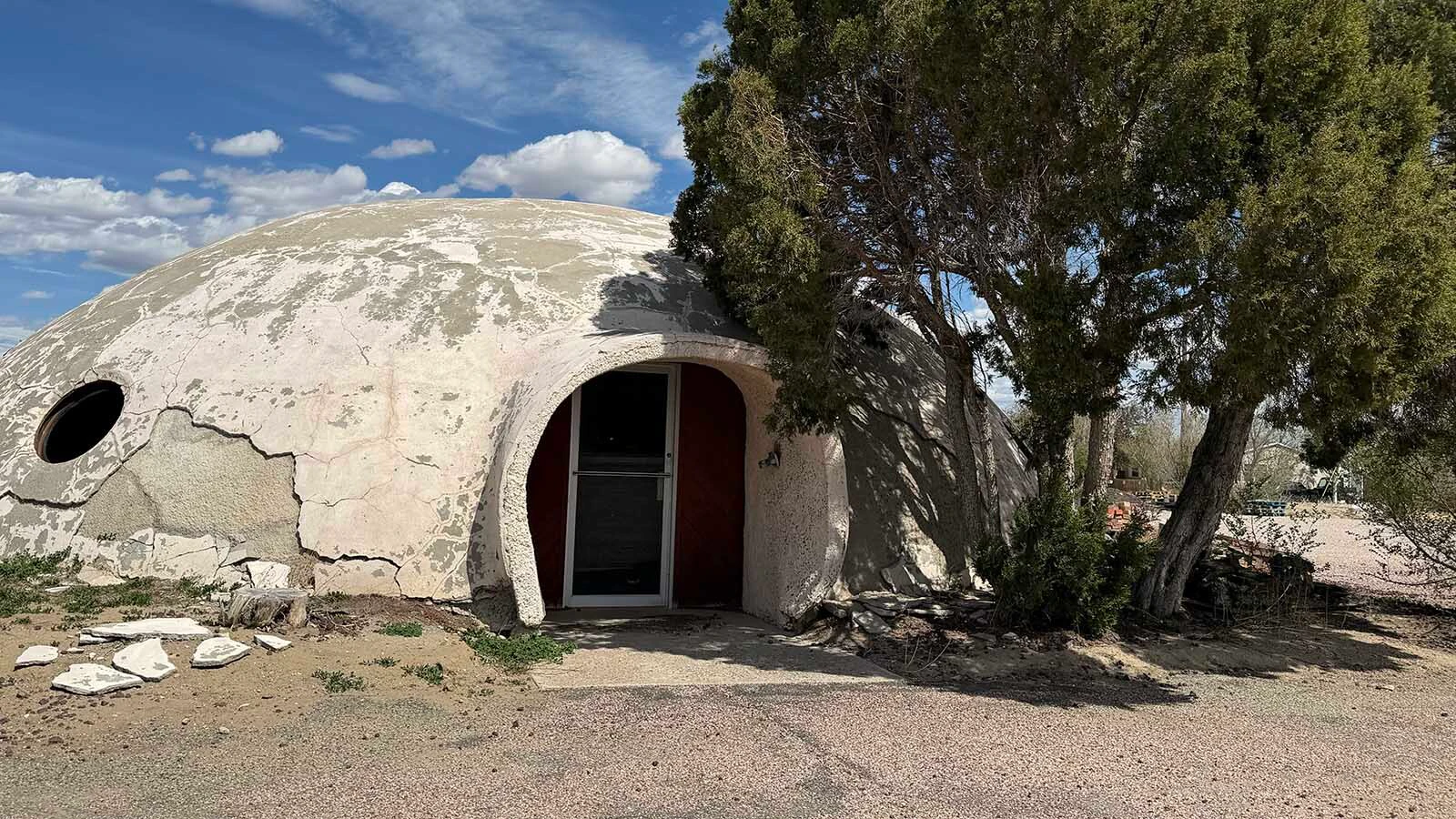 Cracked and weatherworn beside South Street in Wheatland, the strange concrete dome looks more like a stranded UFO than the old Wyoming DMV it once was.