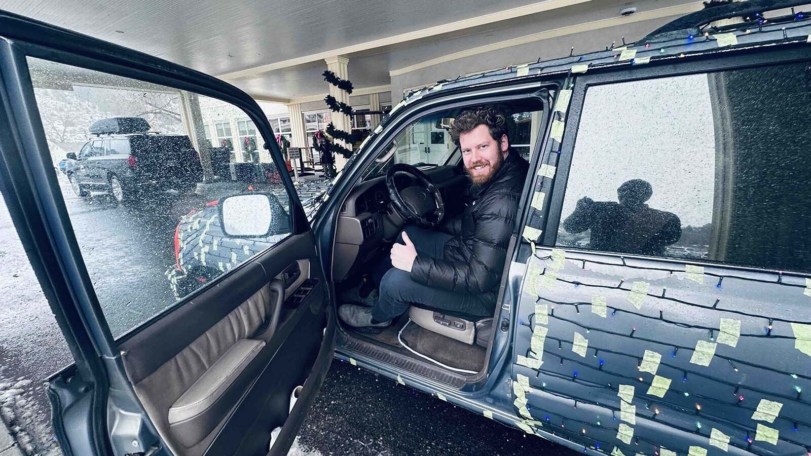 Timothy Erickson always wanted to transform his 1996 Toyota Landcruiser into a Christmas Cruiser. While driving to Mammoth Hot Springs, a wind gust busted his hood latch, so he had to strap down the hood on his yuletide 4x4.