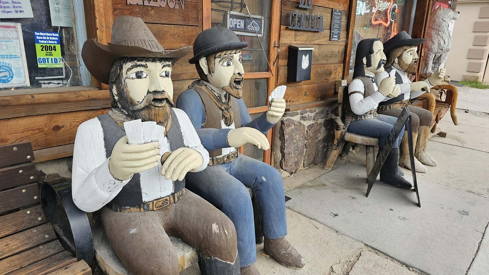 A perpetual card game goes on outside the White Wolf Saloon in Douglas, which has a new owner.
