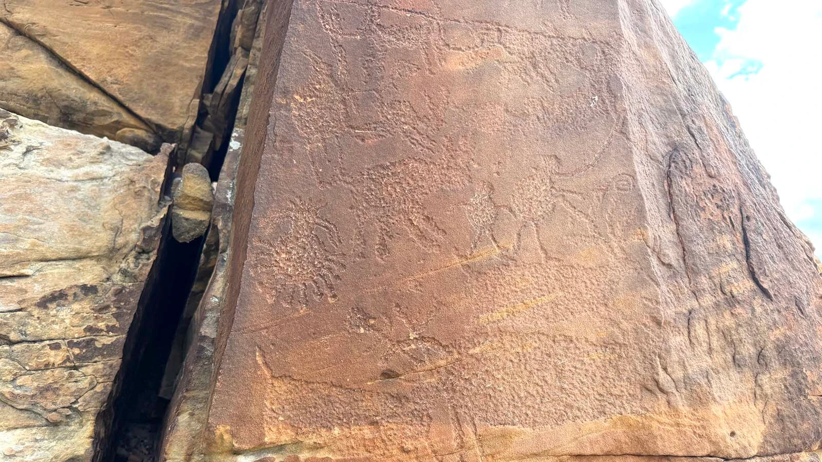 One of the petroglyph panels at Whoopup Canyon in Crook County. These panels are too old to belong to any one Native American tribe, as they depict the nomadic tribe that followed game across North America between 2,000 and 10,500 years ago.