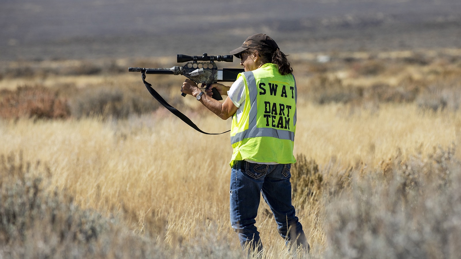 Robin Wadhams, a member of the volunteer Sand Wash Advocate Team (SWAT), prepares to dart wild horse mares with fertility-control drugs in northwest Colorado.