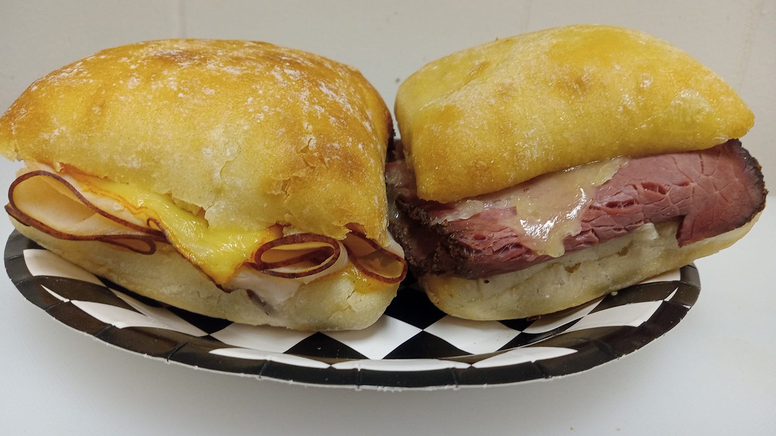 Chiabatta melts: turkey and muenster, and pastrami with havarti.