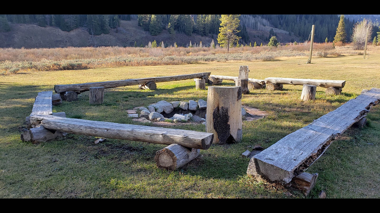 A fire pit with bench seating at Granite Creek Ranch.