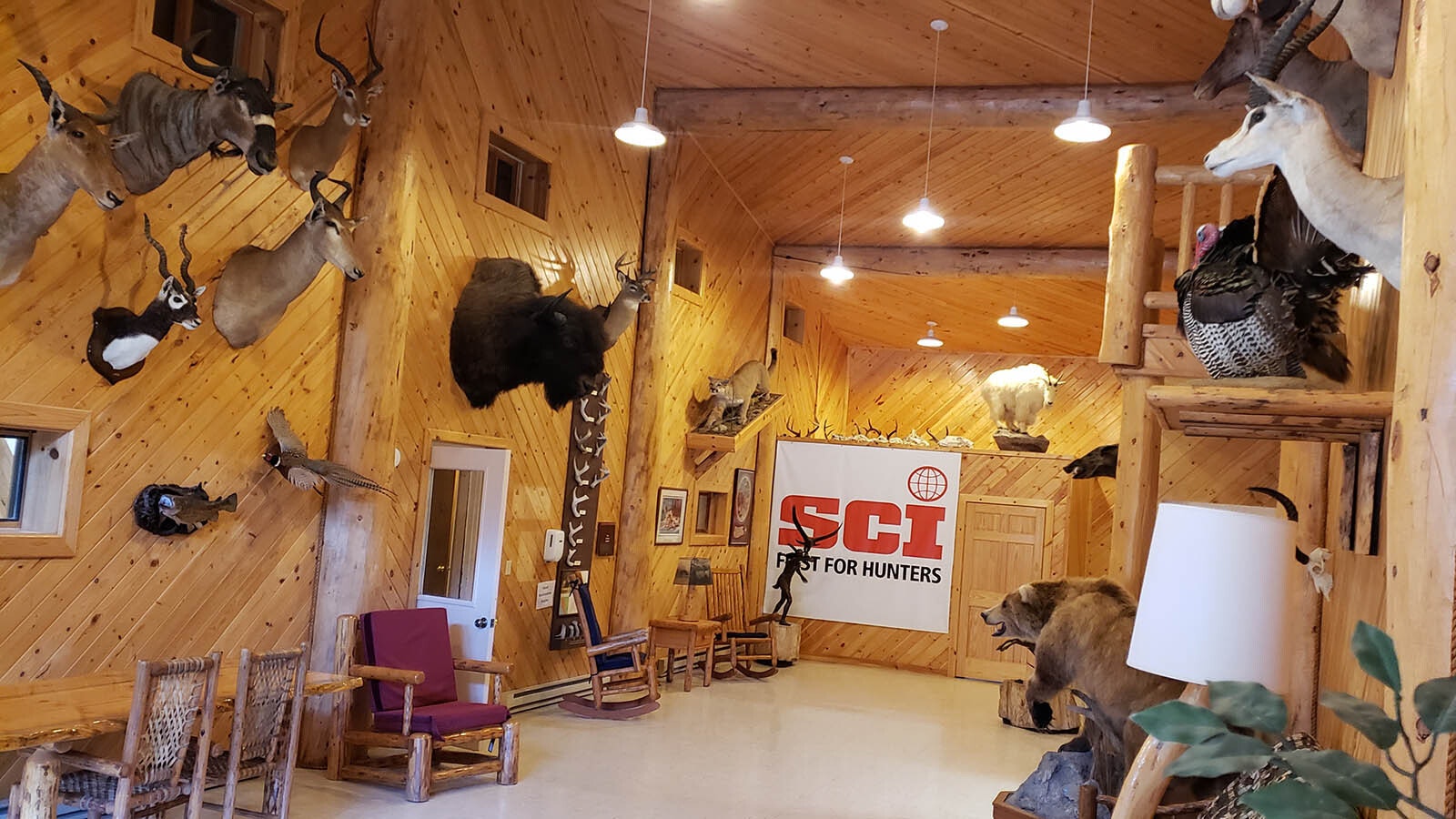 The lobby at Granite Creek Ranch's lodge is decorated with many head mounts from game animals.