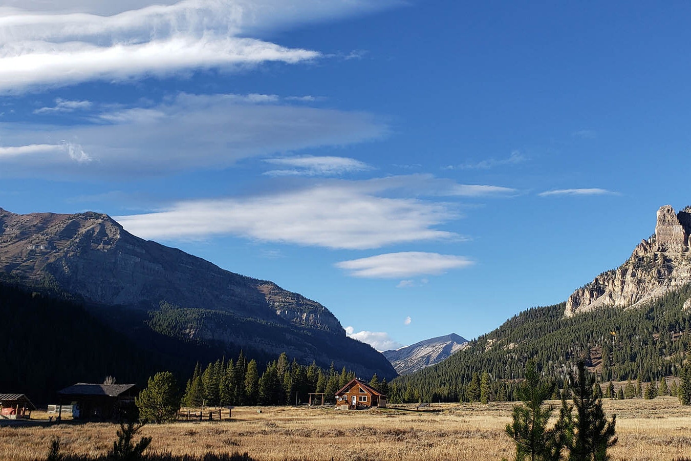 The view is amazing at Granite Creek Ranch. The caretakers' residence appears small beside the mountains.