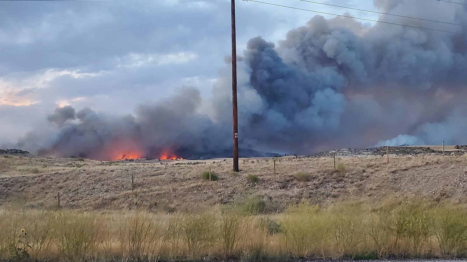 The combine Pleasant Valley/Haystack fires burn unchecked across parts of Platte and Goshen counties.