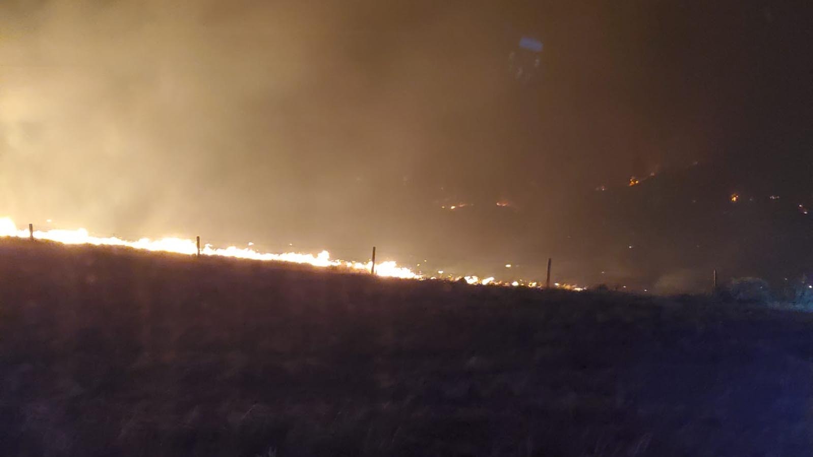 The combine Pleasant Valley/Haystack fires burn unchecked across parts of Platte and Goshen counties.