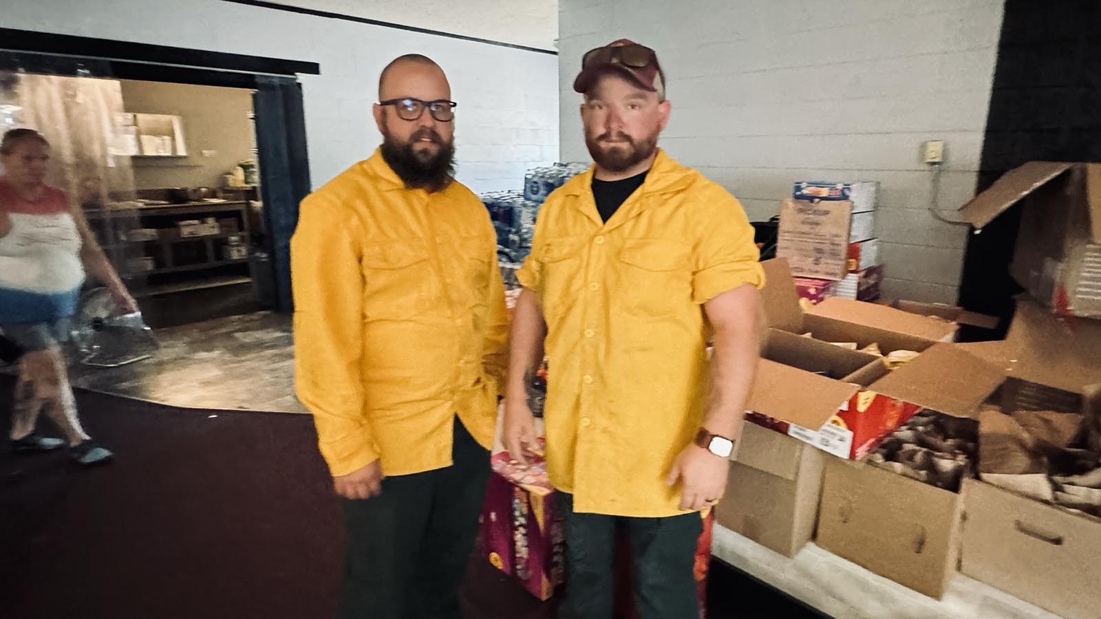 Firefighters Delbert Butcher and Caleb Frink, dirty from putting out flare up fires all day along U.S. Route 26 – the major thoroughfare through Guernsey – stopped by for a case of Gatorade and other snacks at Crazy Tony’s bar and grill.