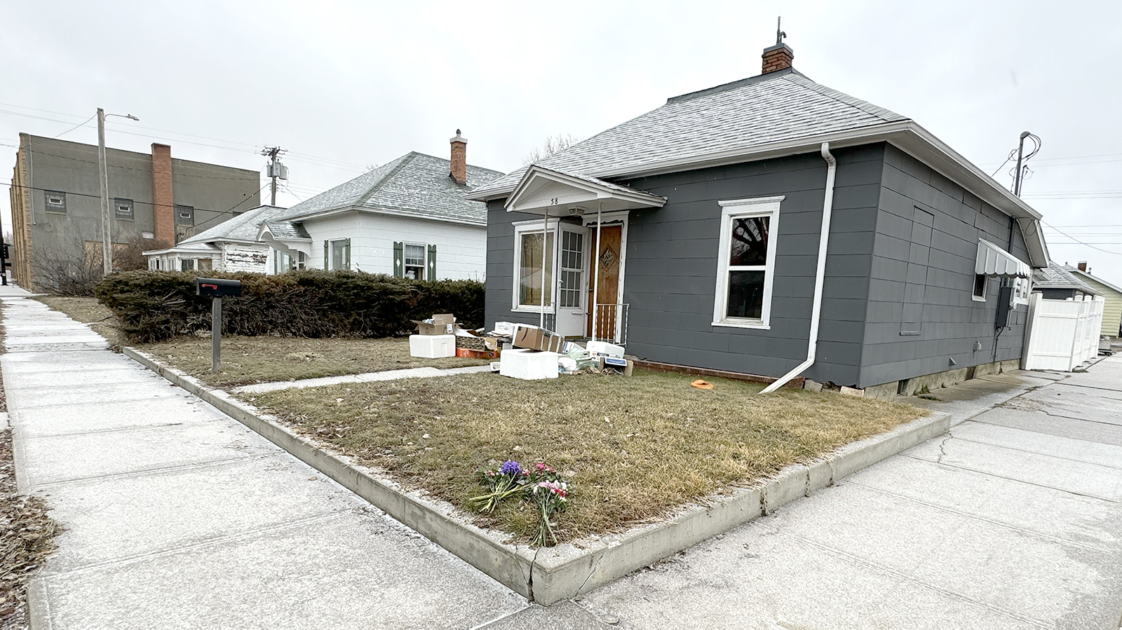The man suspected of shooting and killing a Sheridan police officer in front of this house was also renting it. He'd been squatting for several months and had been ordered to vacate.
