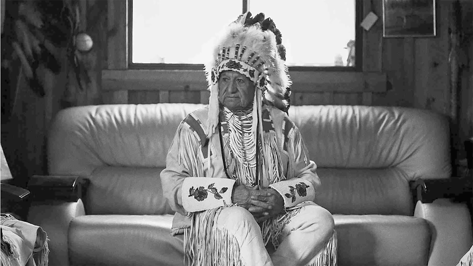 Willie LeClair dressed in his regalia and head dress as a culture ambassador and preserver of the sign language of the Plains.