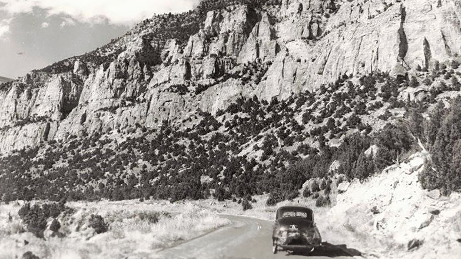 An undated photo showing a car driving to "J. Bob White's place" on the Yellowstone Highway in Wind River Canyon.