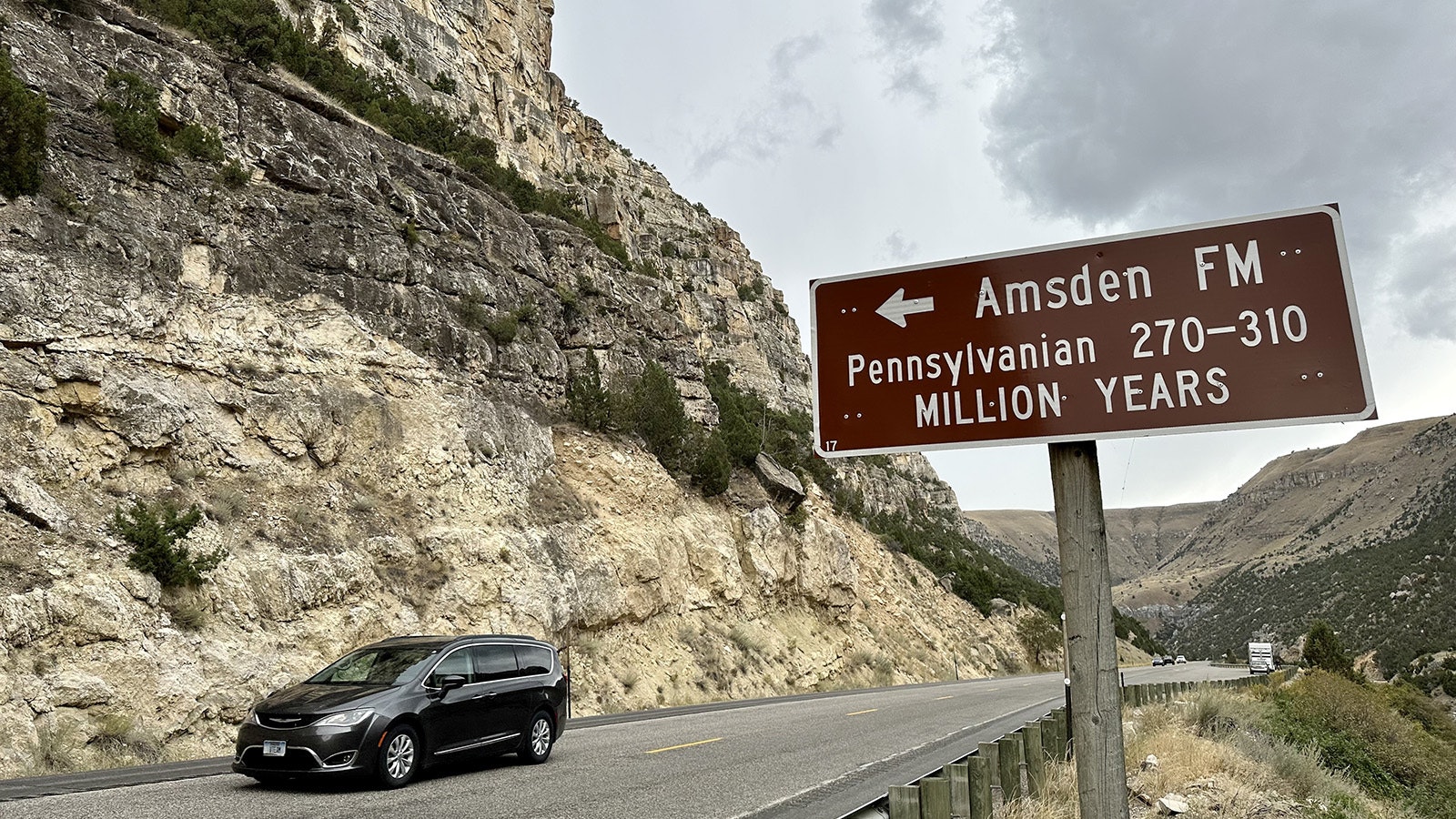 A road sign points out the Amsden Formation near the northern end of the Wind River Canyon. The five most significant rock layers in the canyon are marked by signs telling the name and age of the rock.