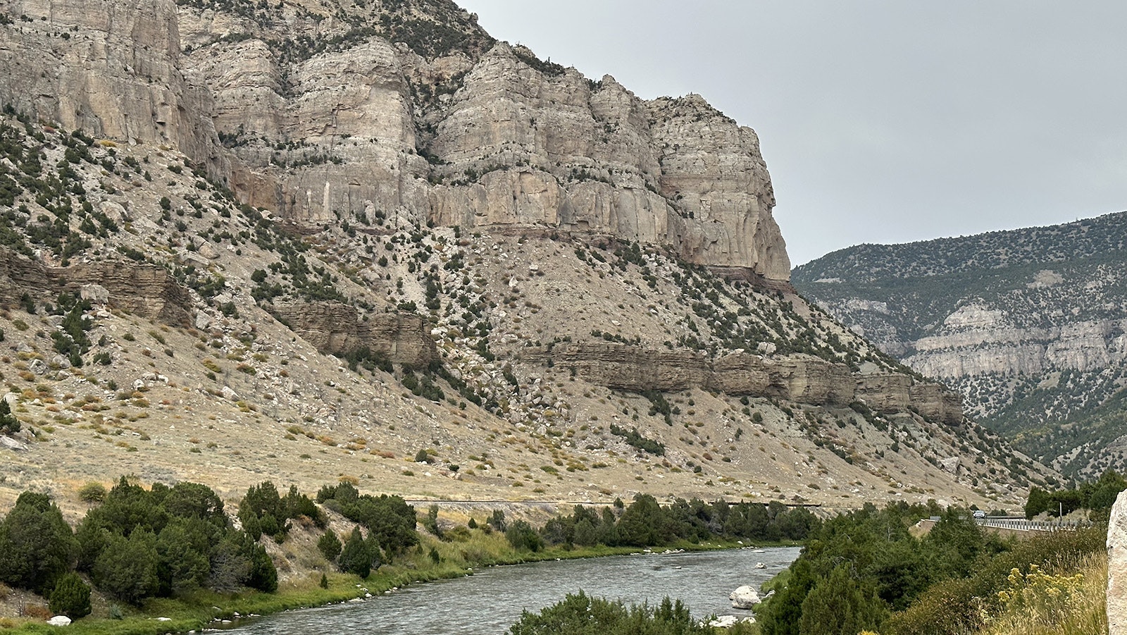 A view inside the Wind River Canyon. At least five different rock formations are visible in this image, and at least 12 rock formations are exposed along the 17 miles of canyon walls.