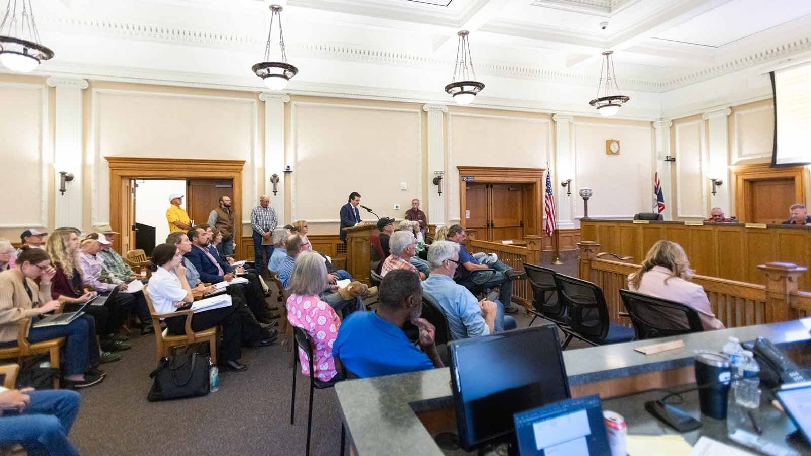 A packed Laramie County Commission meeting where opponents of a wind energy project liked up out the door to speak.