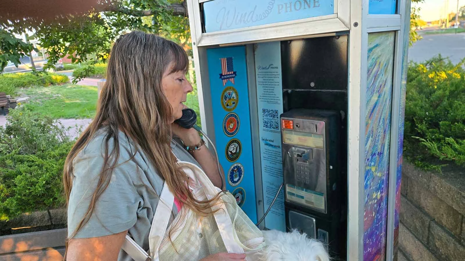 Terry Anne Heglund, who created the artwork covering the booth, says she uses the phone herself and believes there is power in saying the words of grief out loud.