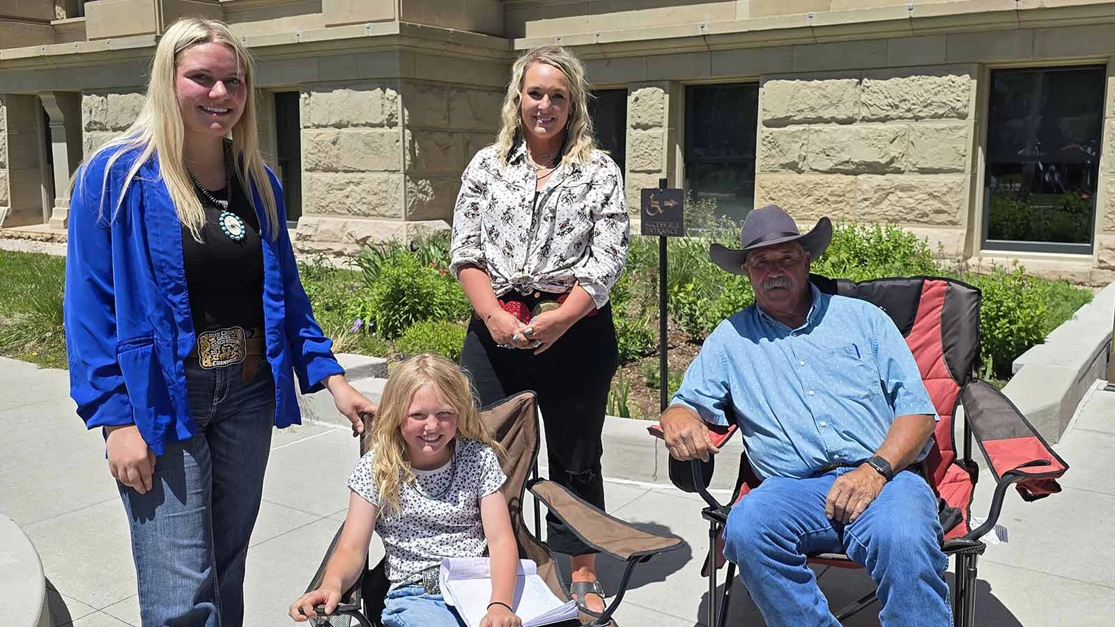 Mike Stephens, far right, brought family members Emory, Acelynn, and Kesley with him to talk about Wyoming's 200-mile "wind wall."