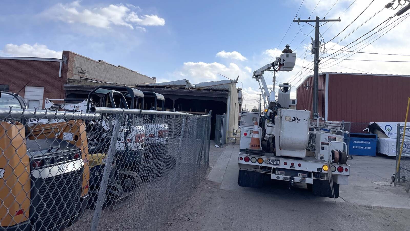 Friday's hurricane-force winds tore part of the roof off a building in Torrington, planting in the drive-thru of a bank across the street.
