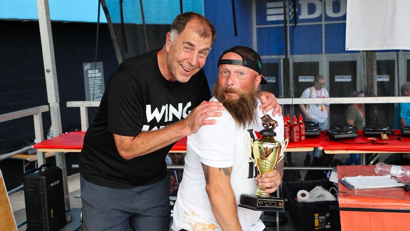 National Buffalo Wing Festival founder and "Wing King" Drew Cerza, left, with Trent Weitzel after Weitzels Wings won for Best Hot Traditional Wing Sauce at the 2024 festival in Buffalo, New York, over the Labor Day weekend.