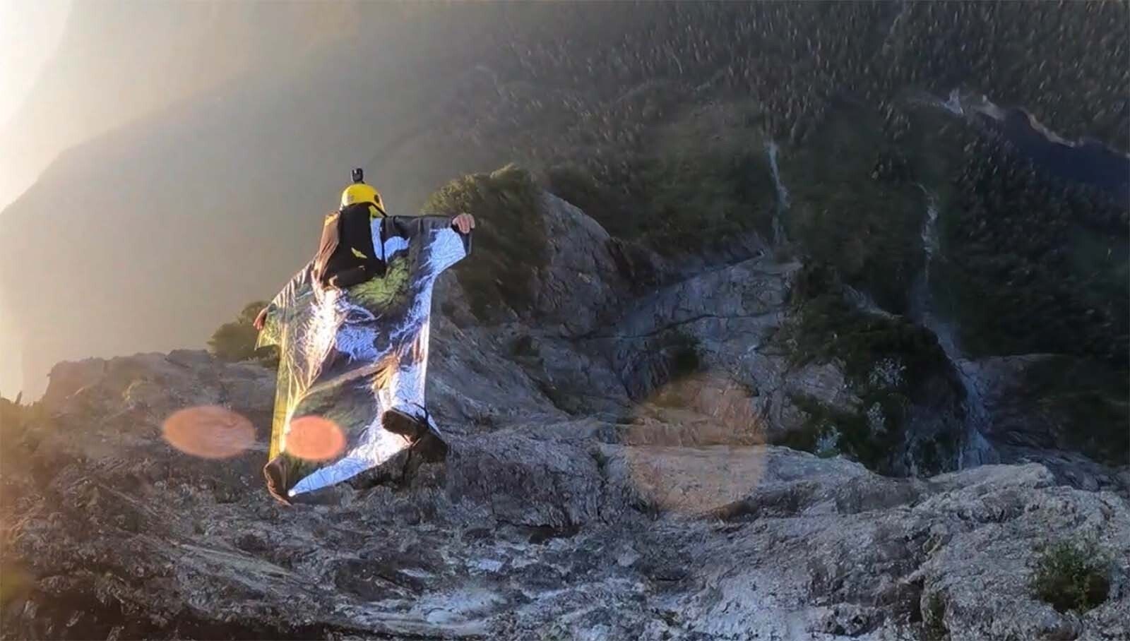 Braden Roseborough flies off a mountain in his wingsuit. He said typically he will build a profile of the mountain with a laser range finder prior to a jump to help him determine an safety issues with the flight.