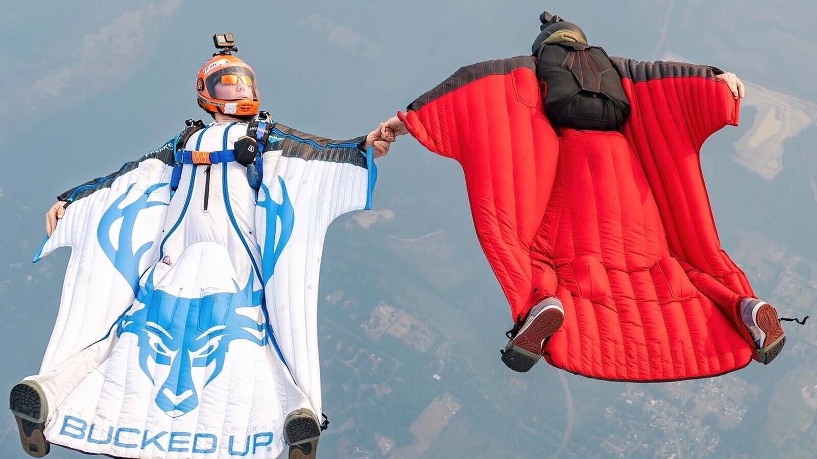 Nikko Mamallo and a friend perform a maneuver high in the sky in their wingsuits.