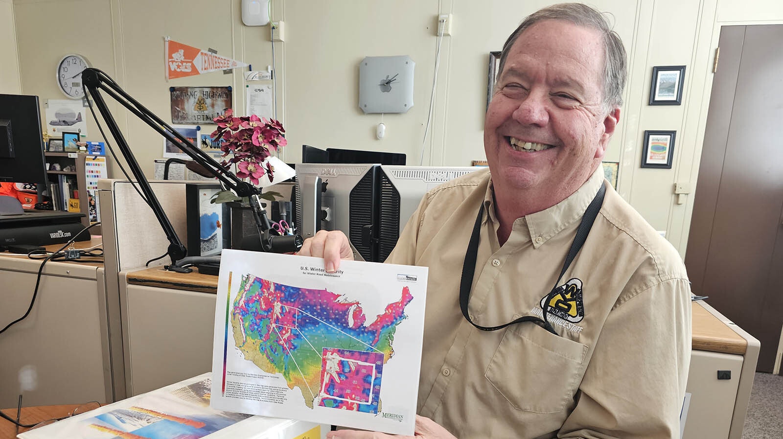 Clifford Spoonmore holds up a map that shows what areas of the country that have the most winter severity when it comes to road maintenance.