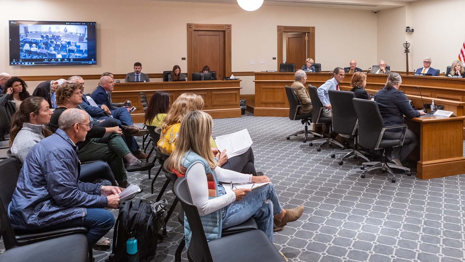 A vocal crowd showed up to give comment to the Joint Travel, Recreation and Wildlife Resources Committee meeting at the Wyoming Capitol in Cheyenne on Monday, Sept. 30, 2024. Most spoke against a proposed bill that stops short of banning running down wolves and other predators with snowmobiles.