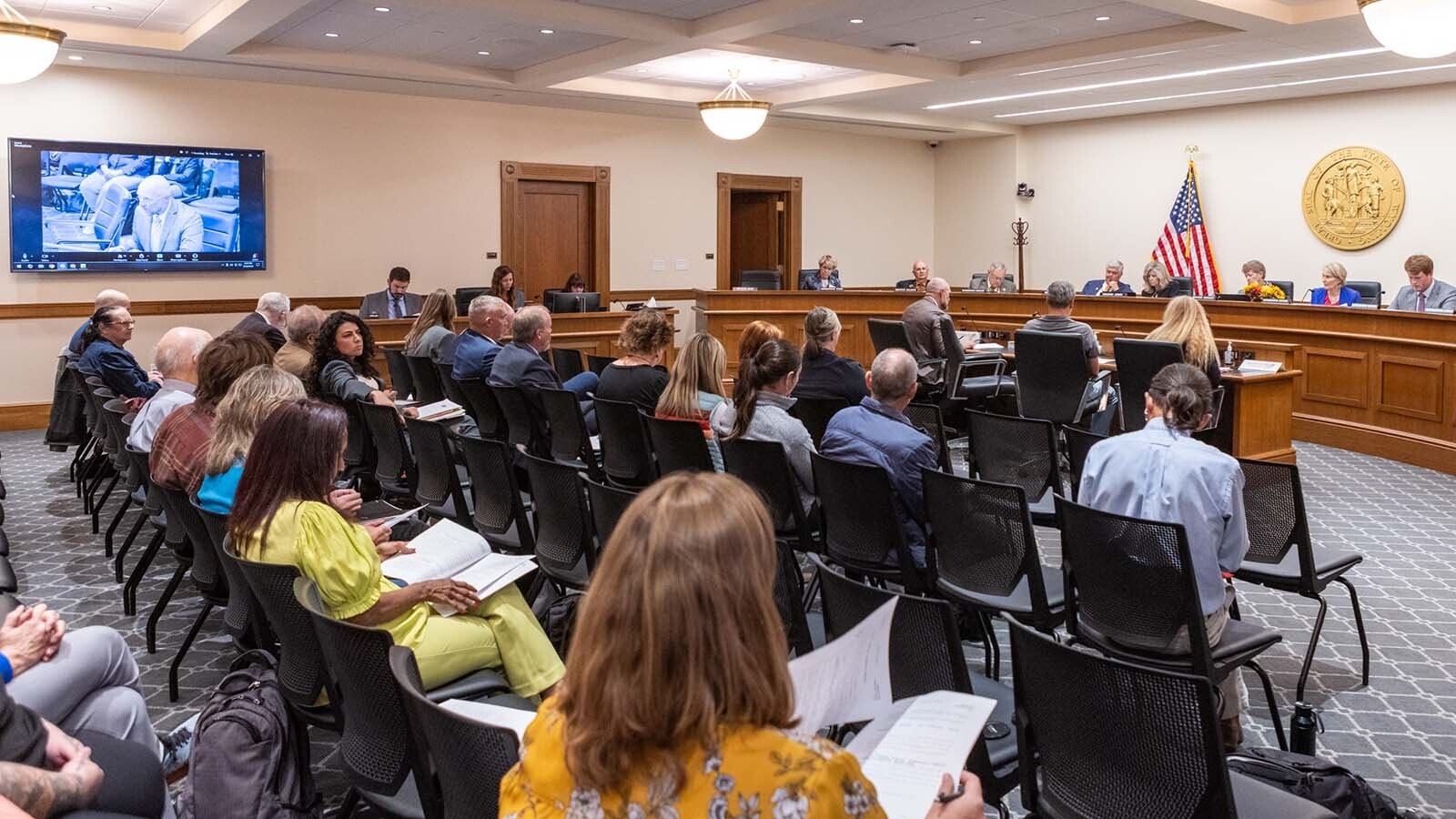 A vocal crowd showed up to give comment to the Joint Travel, Recreation and Wildlife Resources Committee meeting at the Wyoming Capitol in Cheyenne on Monday, Sept. 30, 2024. Most spoke against a proposed bill that stops short of banning running down wolves and other predators with snowmobiles.