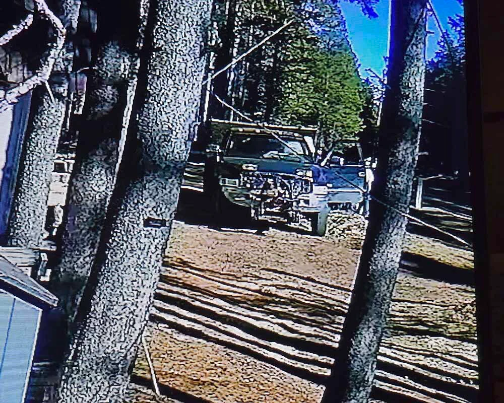 A pickup is captured by a surveillance camera on Katie Snyder-Lijewski’s Casper Mountain property during the period when she says cut wood was being taken from properties along KTWO Road.