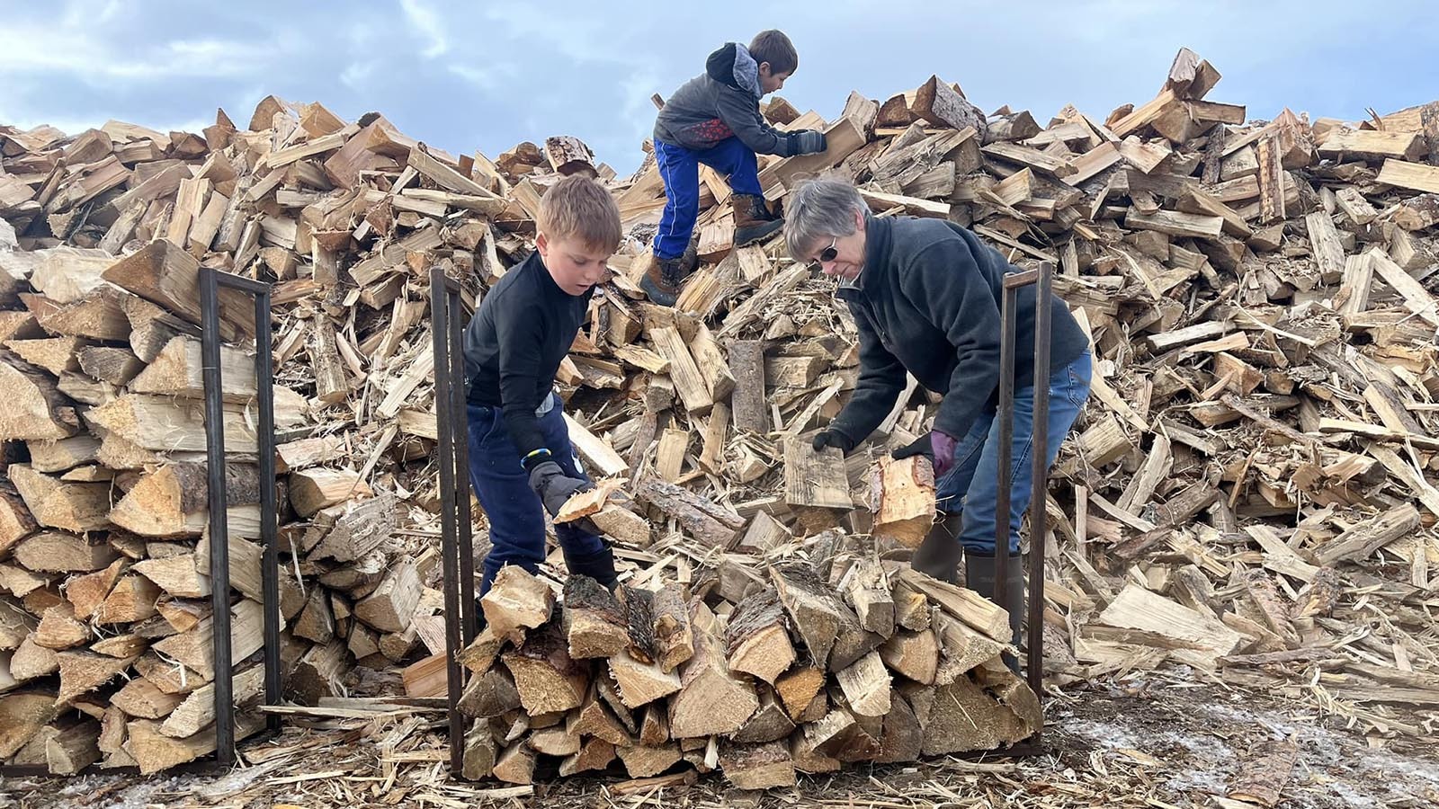Volunteers load up a Clear Creek Wood Bank rack that holds one-seventh of a cord.