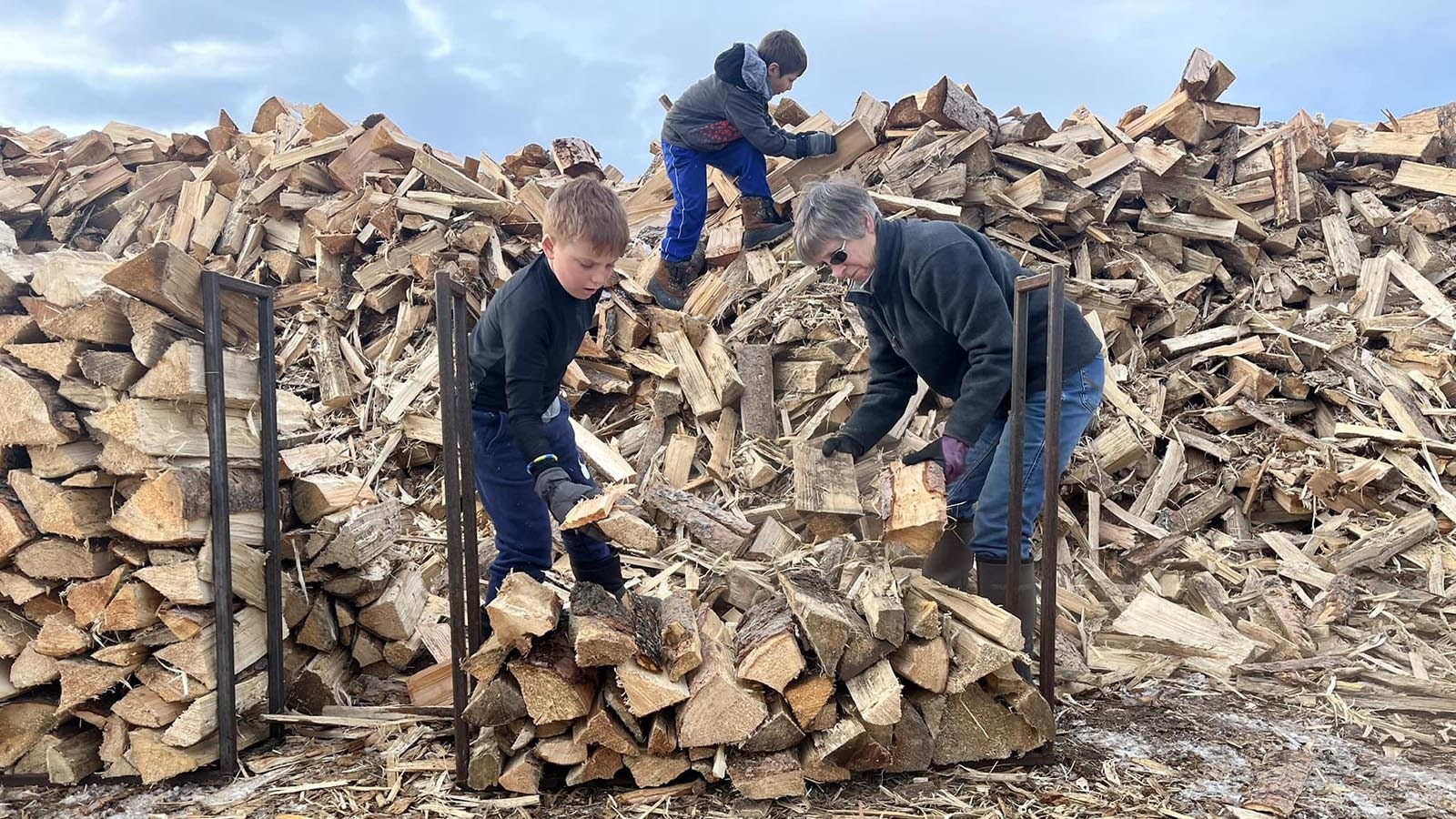 Volunteers load up a Clear Creek Wood Bank rack that holds one-seventh of a cord.