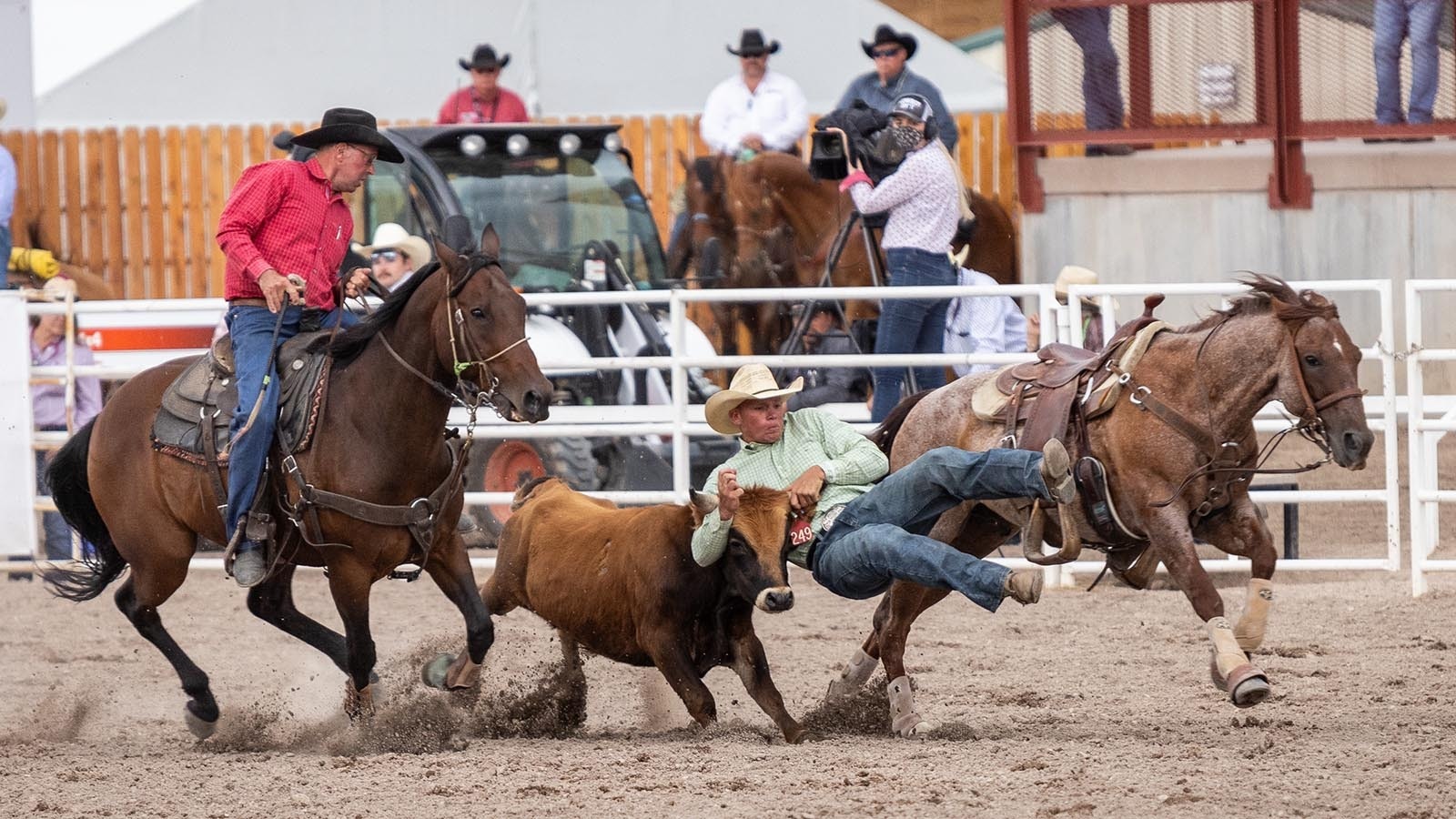 Cowboys compete in the Cheyenne Frontier Days Rodeo, billed as the "Daddy of 'em All," in this file photo.