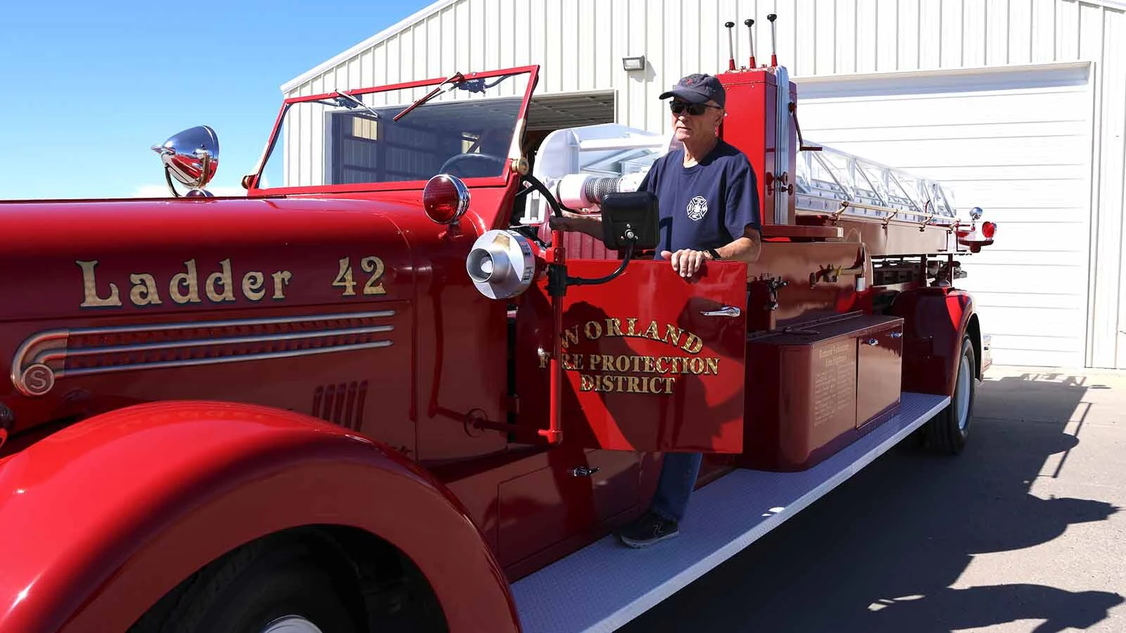 Bruce Nielson climbs out the 1942 Seagraves 65-foot ladder truck.