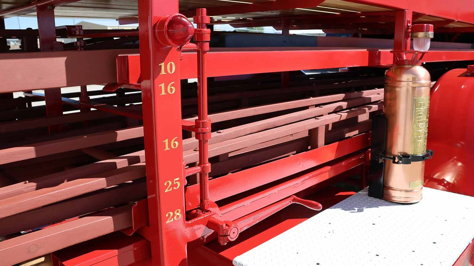The passenger-side pillar at the back of the truck gave firefighters quick knowledge of the length of various ladders and extensions. 