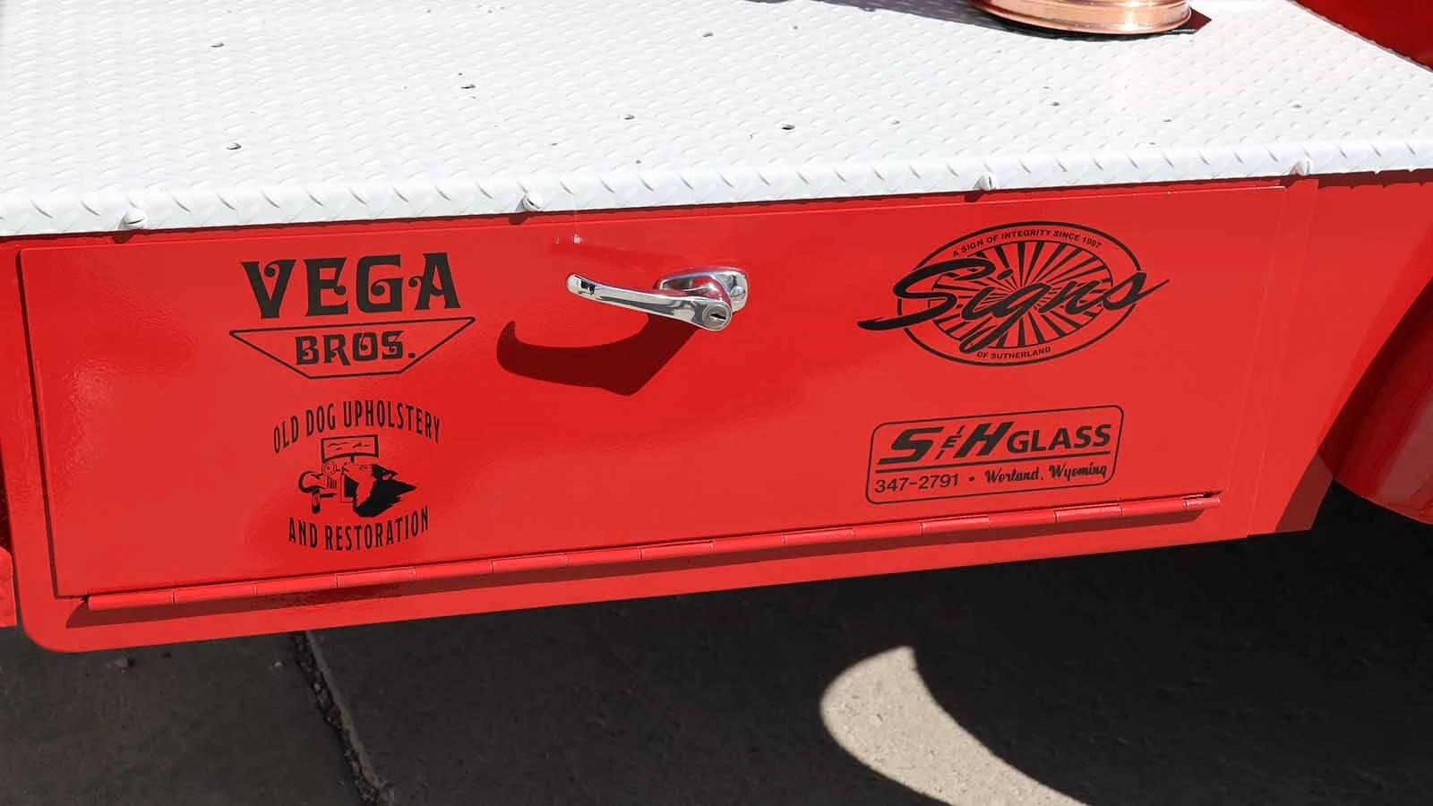 The fire department put the logos of the businesses who helped with the restoration on the truck. 