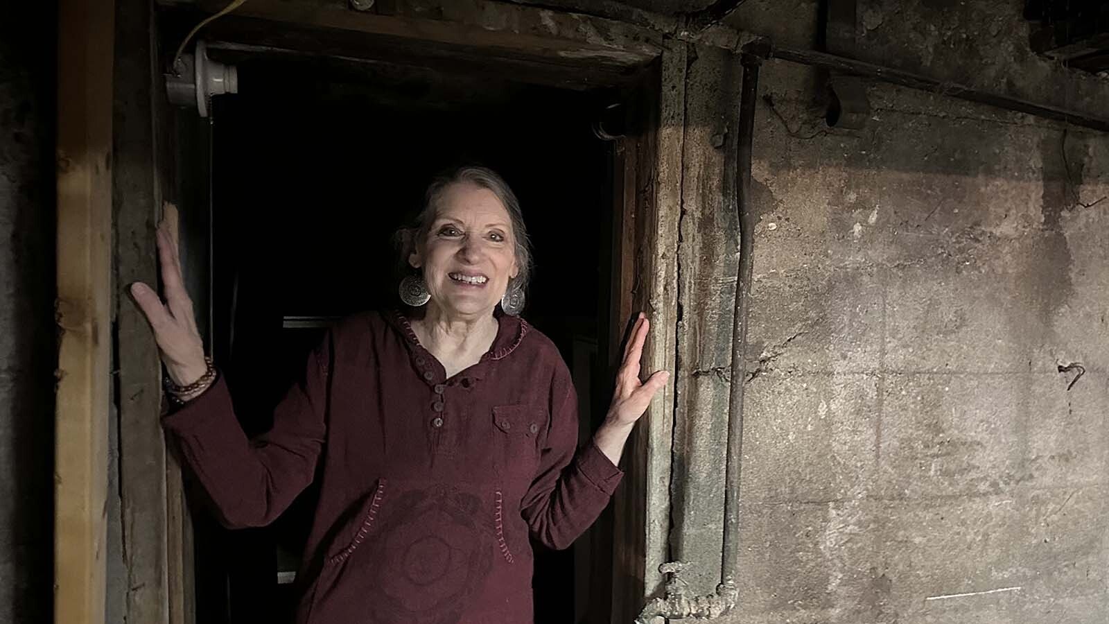 Terri Craft pauses in the doorway beneath Bee Healthy, her health food store. While upstairs is alive with activity, the basement is seldom visited but it is alive with remnants of the past, including an abandoned tunnel that is believed to have been dug during Prohibition when the building was a former saloon and boarding house.