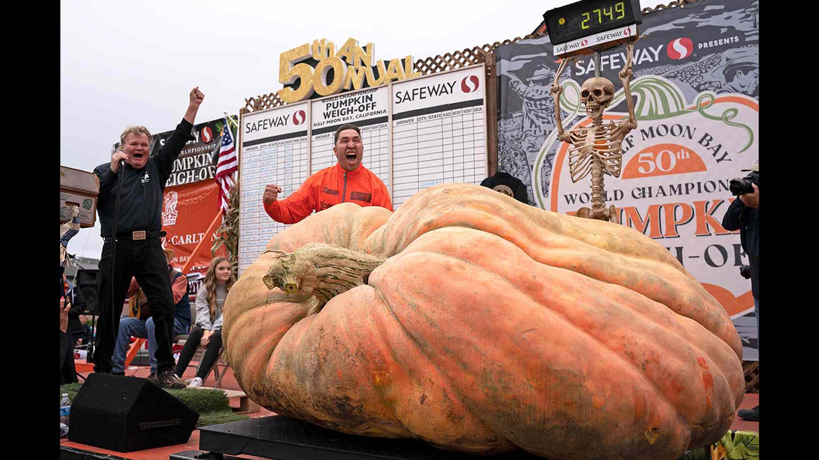 Travis Gienger of Minnesota reacts after his pumpkin weighed in at a world-record 2,749 pounds at Monday's world championship weigh-off in Half Moon Bay, California.