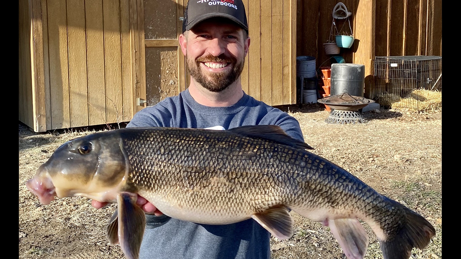 Patrick Edwards shows the world record 6-pound, 8-4.-ounce white sucker he caught in Wyoming.
