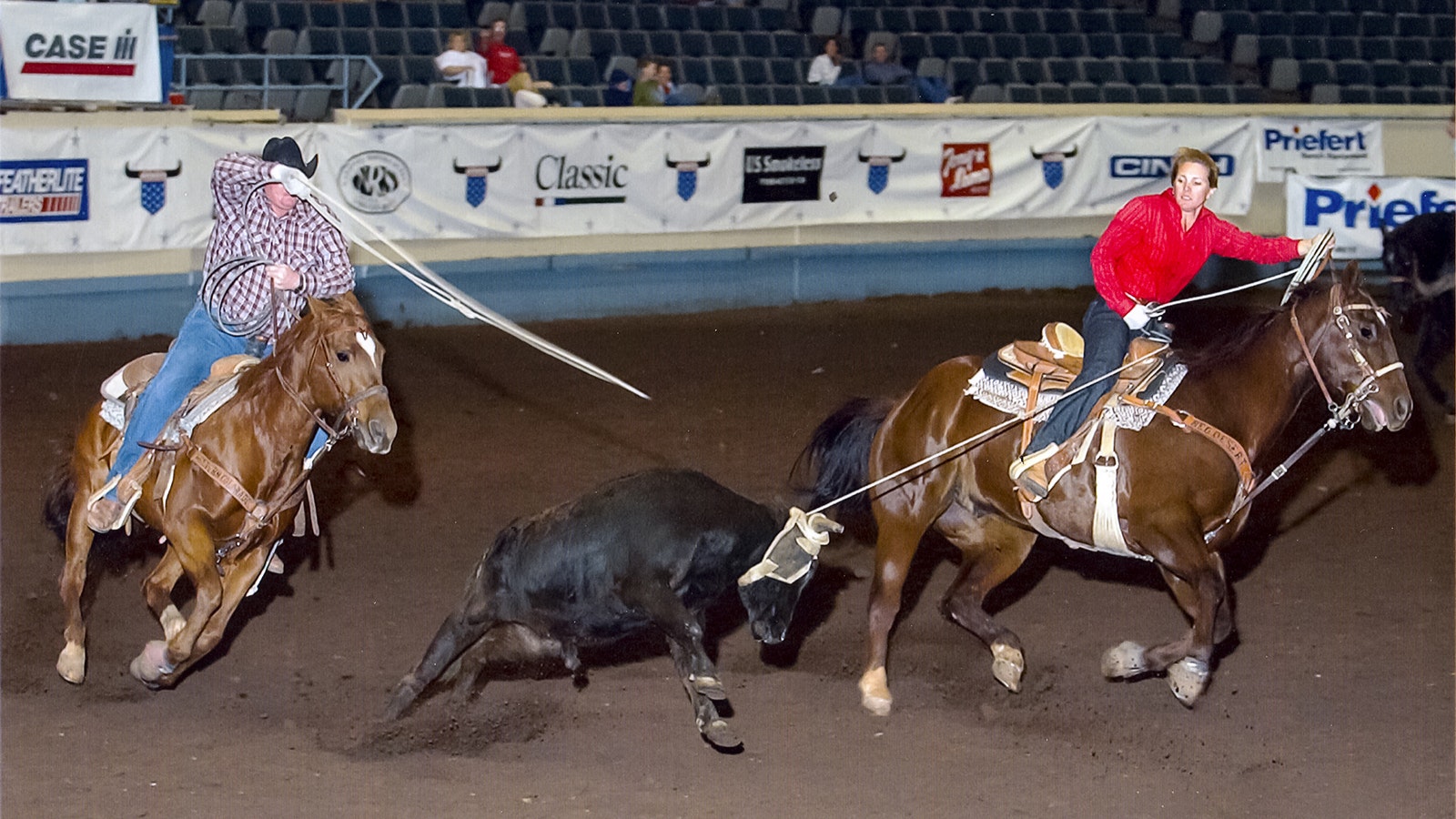 Jim and Paulette Moss roping together at the 2004 USTRC Finals in Oklahoma City. After Jim hurt his shoulder in a roping event, Paulette roped another eight years before she realized he wasn’t coming back. She retired and focused on their magazine.