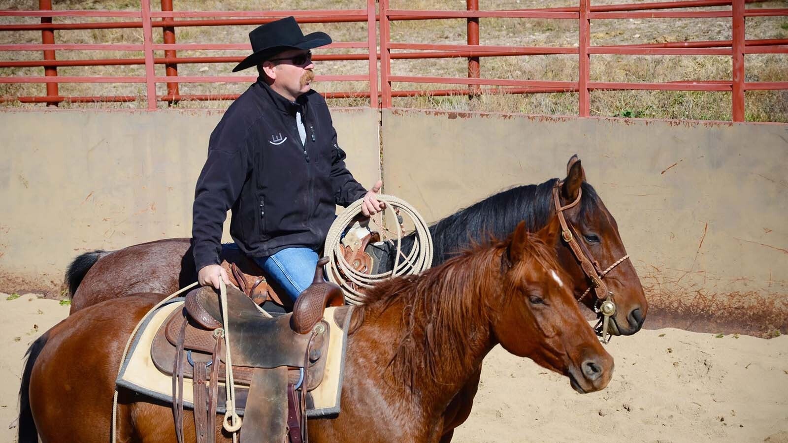 Kevin Meyer gets a young colt started by riding him alongside a saddled oder horse. Meyer is a horse trainer with a ranch called Mantz Creek Horses in Douglas He got his start as a wrangler.
